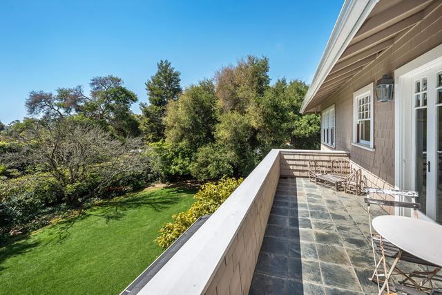 a view of balcony with yard