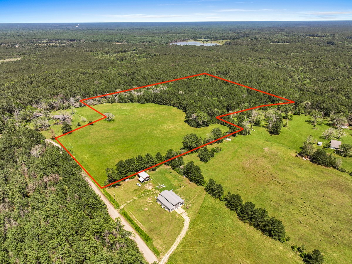 0 Sanford Road Corrigan, TX 75939 - Photo 2 of 17 a view of a lake with a yard