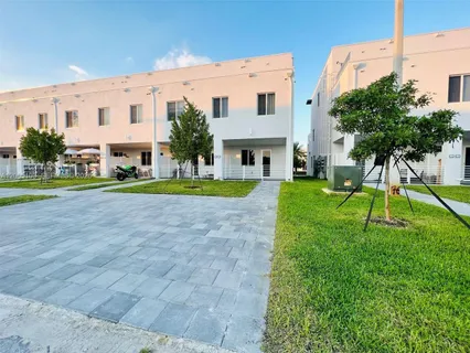 a car parked in front of a brick building
