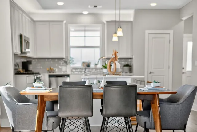 a view of a balcony with chair and iron stairs