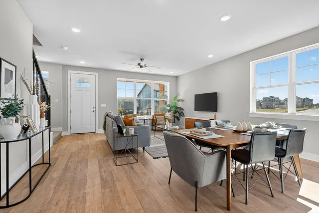 a view of a dining room with furniture window and wooden floor