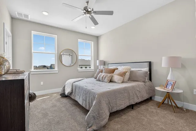 a bathroom with a double vanity sink mirror and shower
