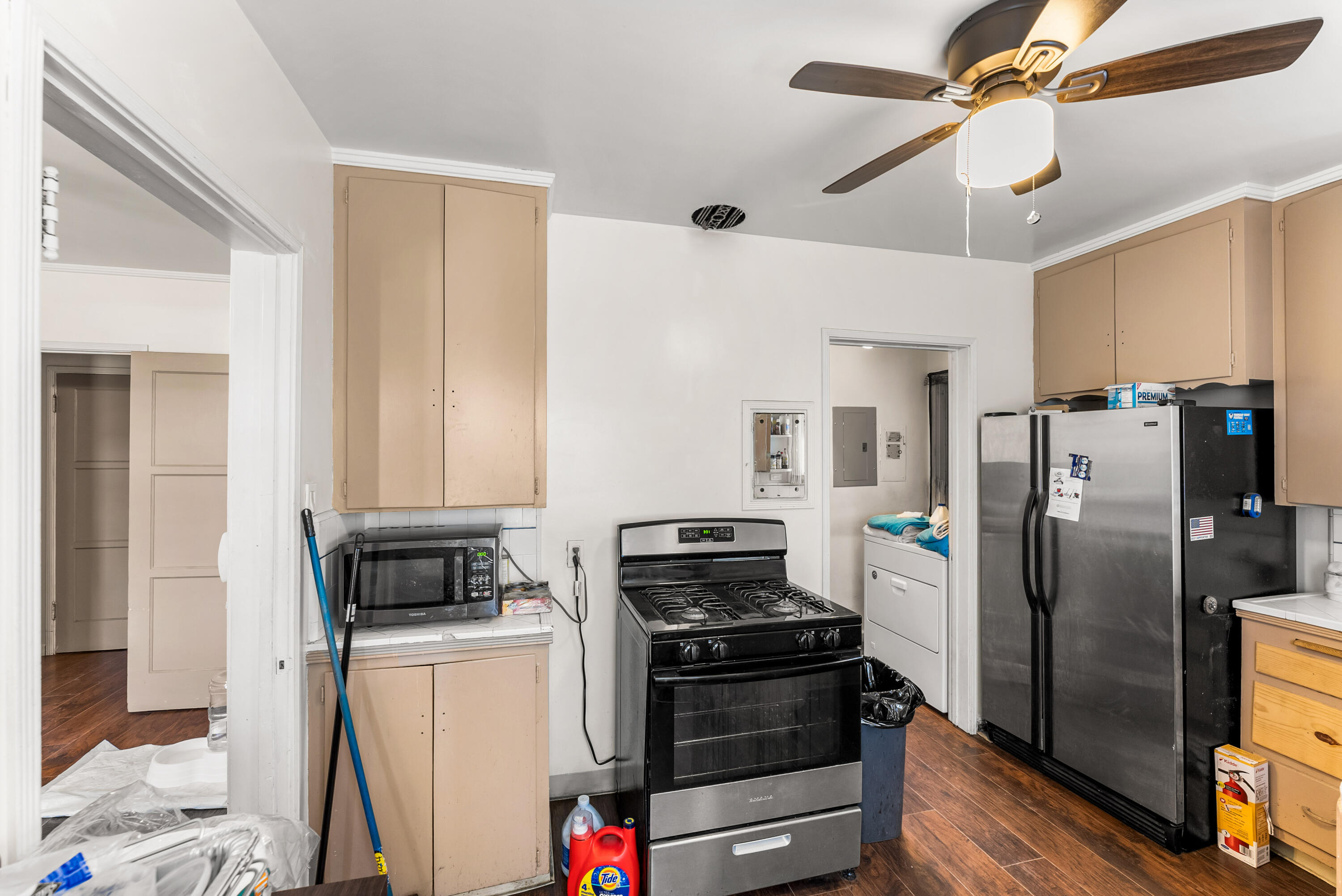 620 South Chester Avenue Compton, CA 90221 - Photo 11 of 32 a kitchen with a refrigerator and a stove