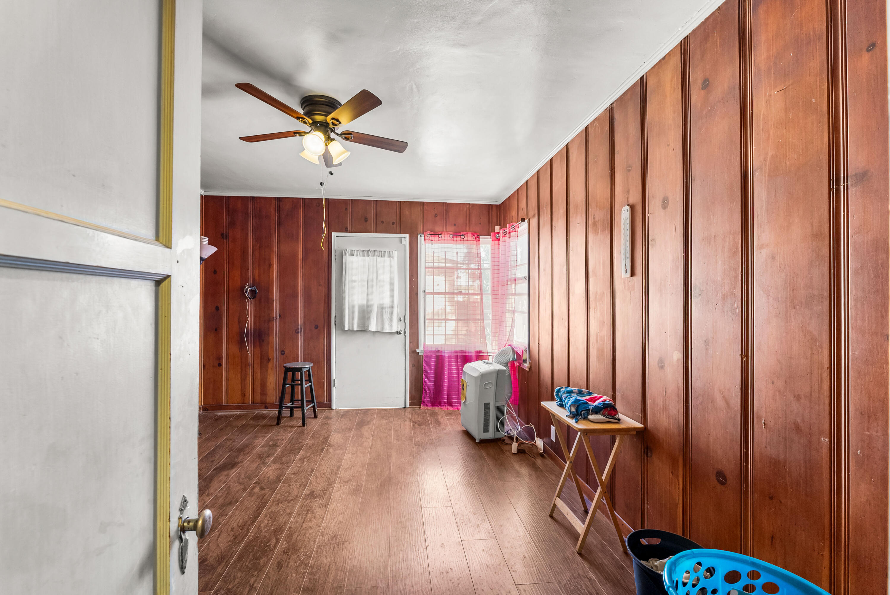 620 South Chester Avenue Compton, CA 90221 - Photo 14 of 32 a view of a room with furniture and wooden floor
