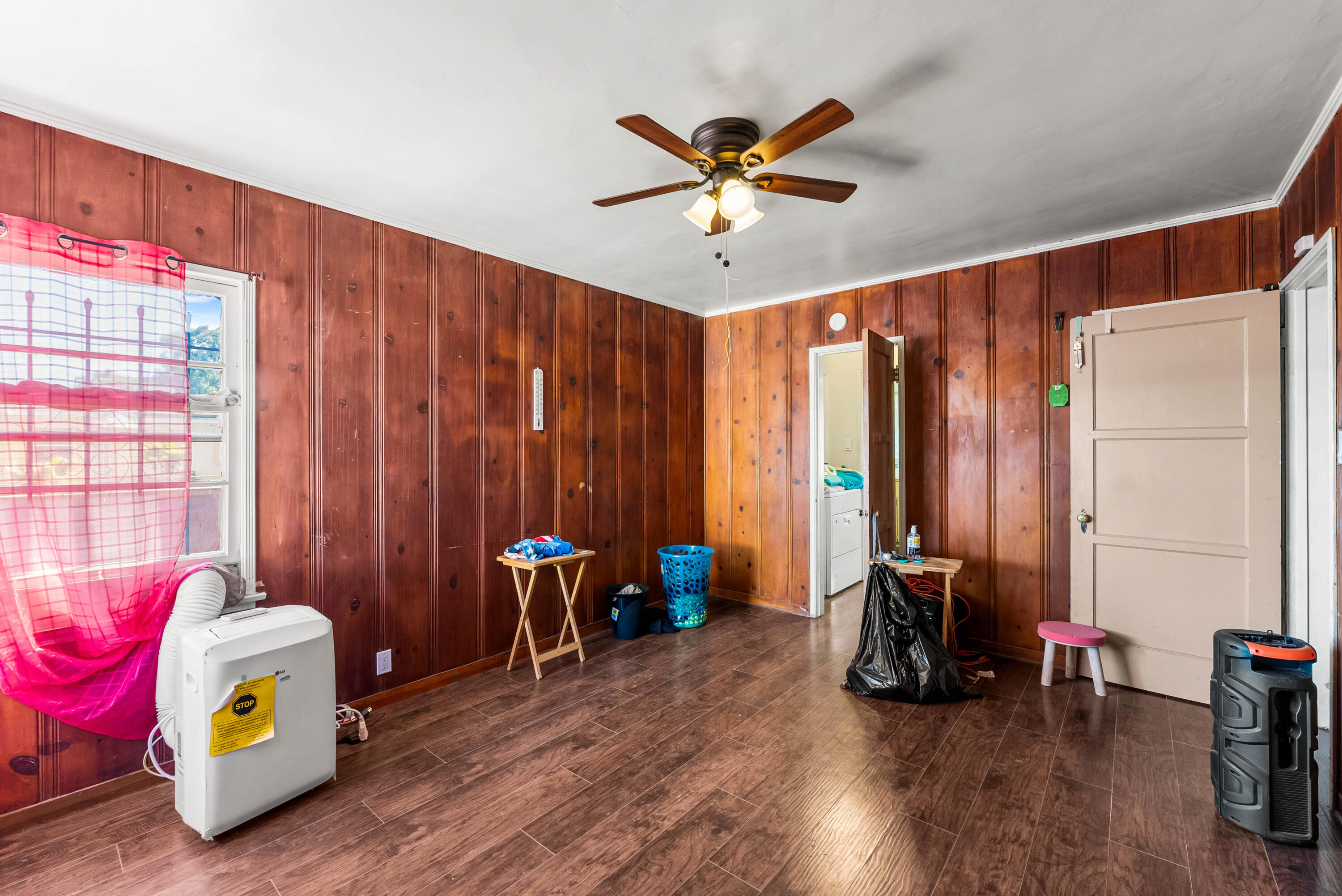 620 South Chester Avenue Compton, CA 90221 - Photo 16 of 32 a view of a bedroom with furniture and wooden floor