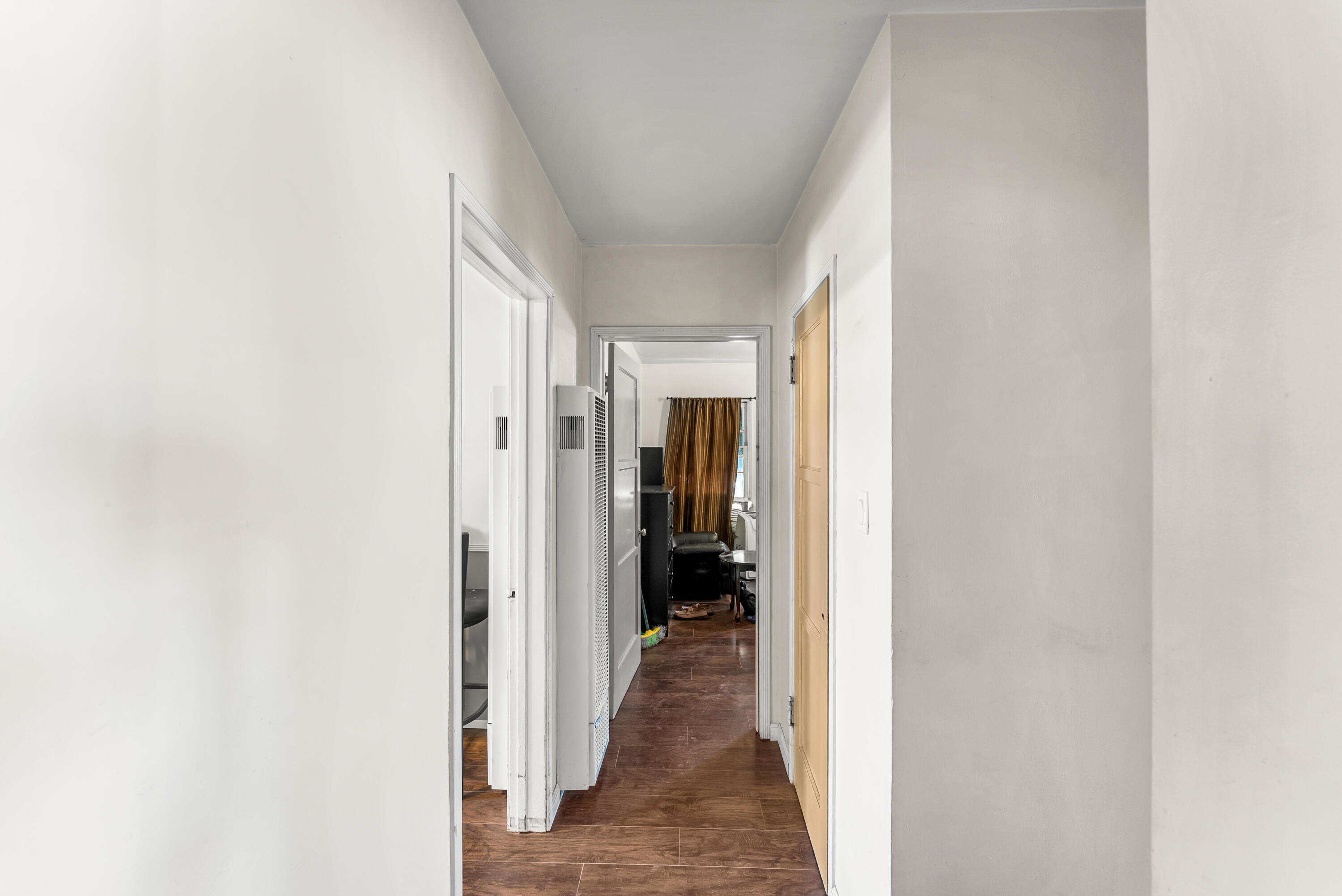620 South Chester Avenue Compton, CA 90221 - Photo 17 of 32 a view of a hallway with wooden shelves