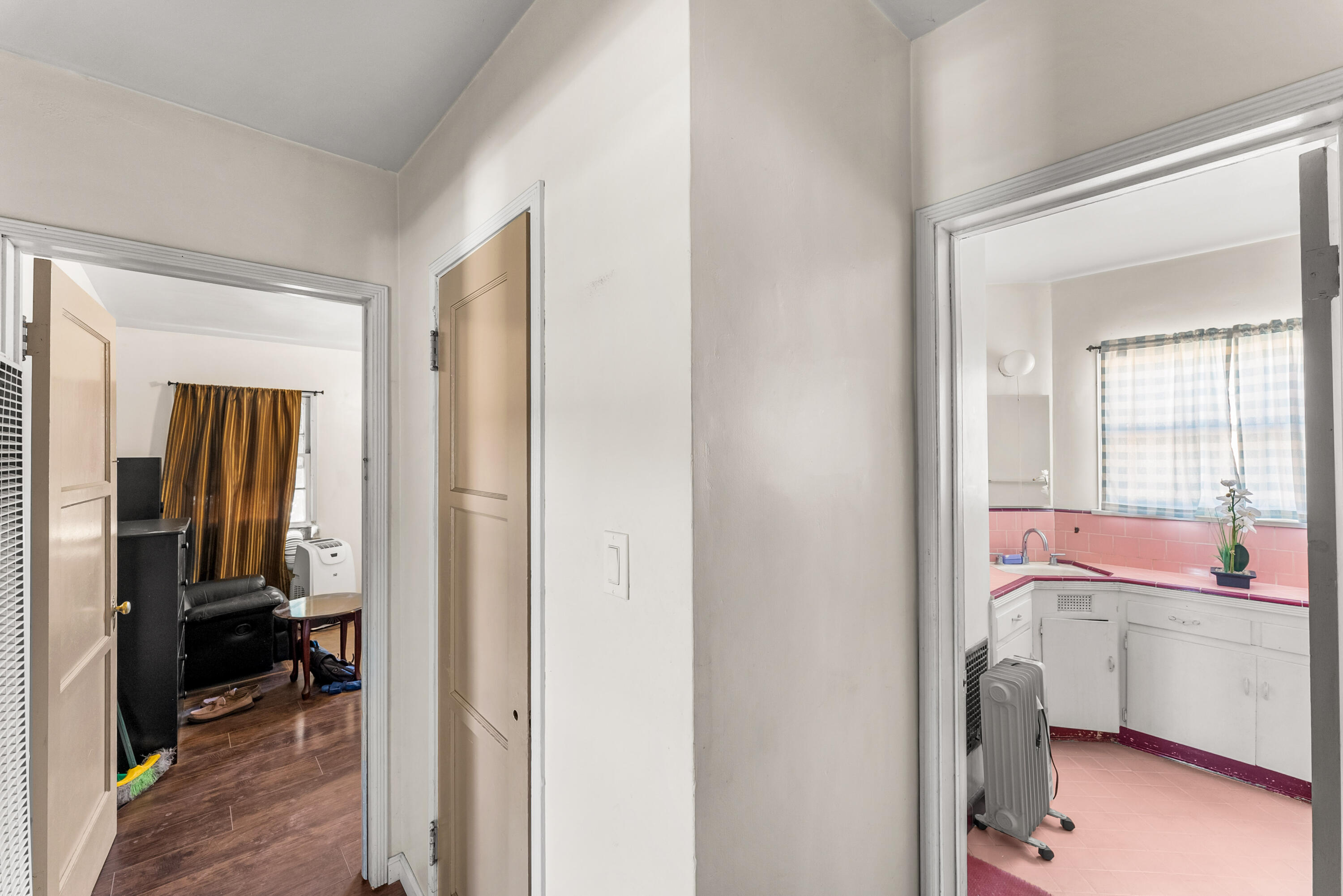 620 South Chester Avenue Compton, CA 90221 - Photo 20 of 32 a view of a room that has a bed and a workspace