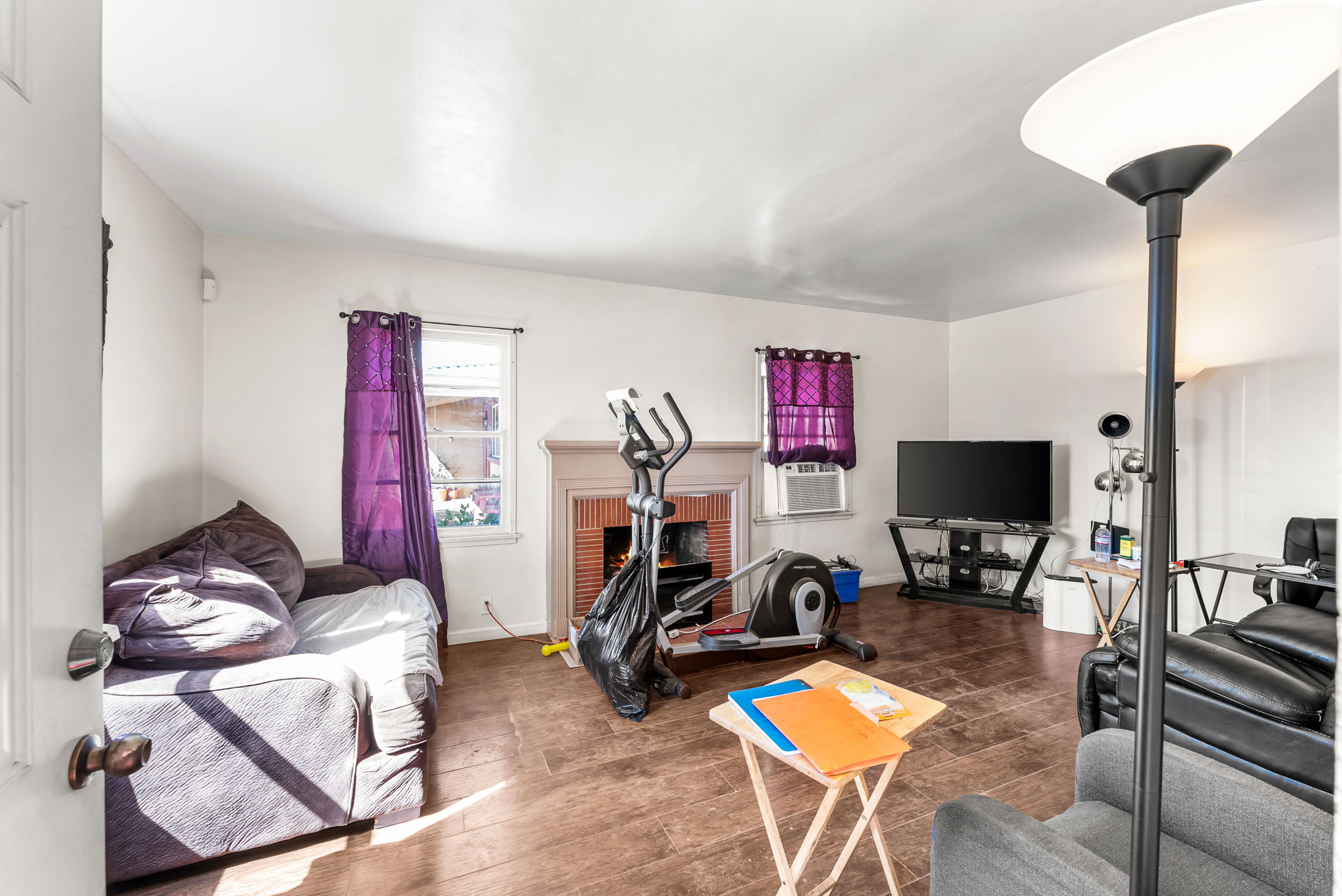 620 South Chester Avenue Compton, CA 90221 - Photo 3 of 32 a living room with furniture and a flat screen tv