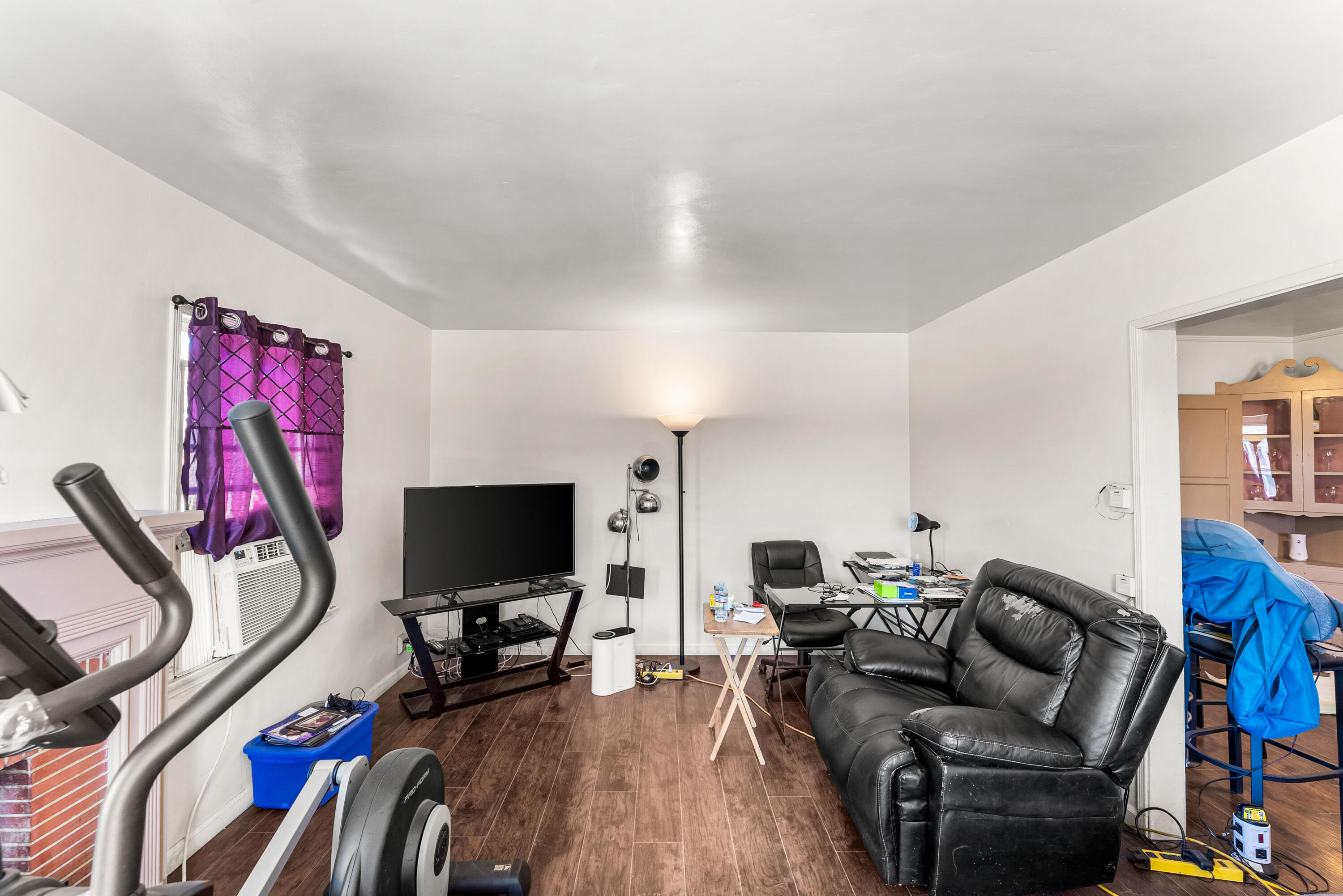 620 South Chester Avenue Compton, CA 90221 - Photo 4 of 32 a living room with furniture and a flat screen tv