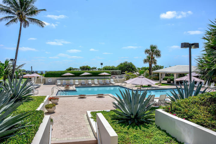 3250 South Ocean Boulevard, Unit 507N Palm Beach, FL 33480 - Photo 12 of 56 a view of a swimming pool with a patio