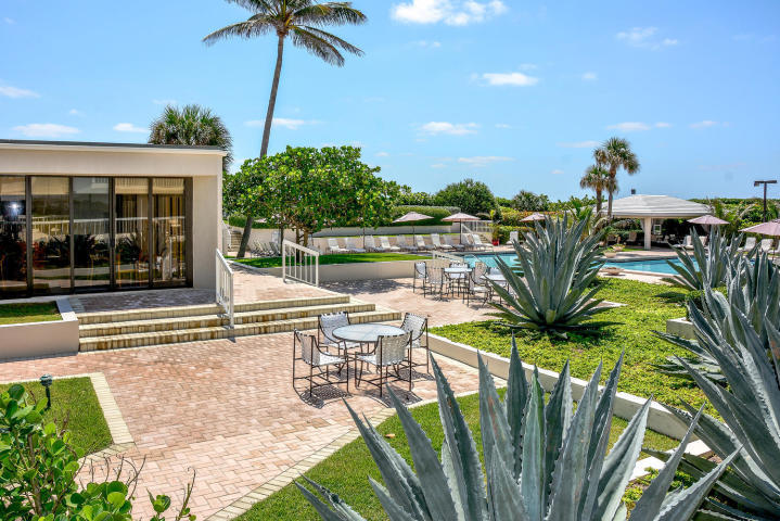3250 South Ocean Boulevard, Unit 507N Palm Beach, FL 33480 - Photo 14 of 56 a view of a swimming pool with a patio