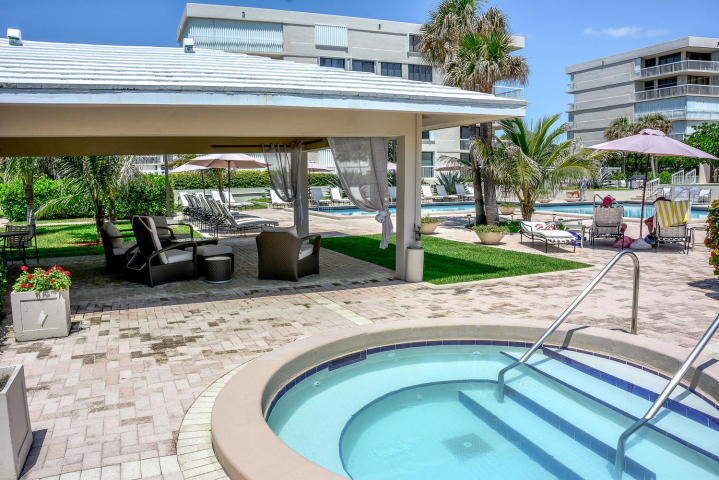 3250 South Ocean Boulevard, Unit 507N Palm Beach, FL 33480 - Photo 15 of 56 a view of a swimming pool with a patio