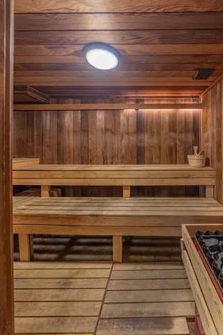 a living room with furniture a large window and a table