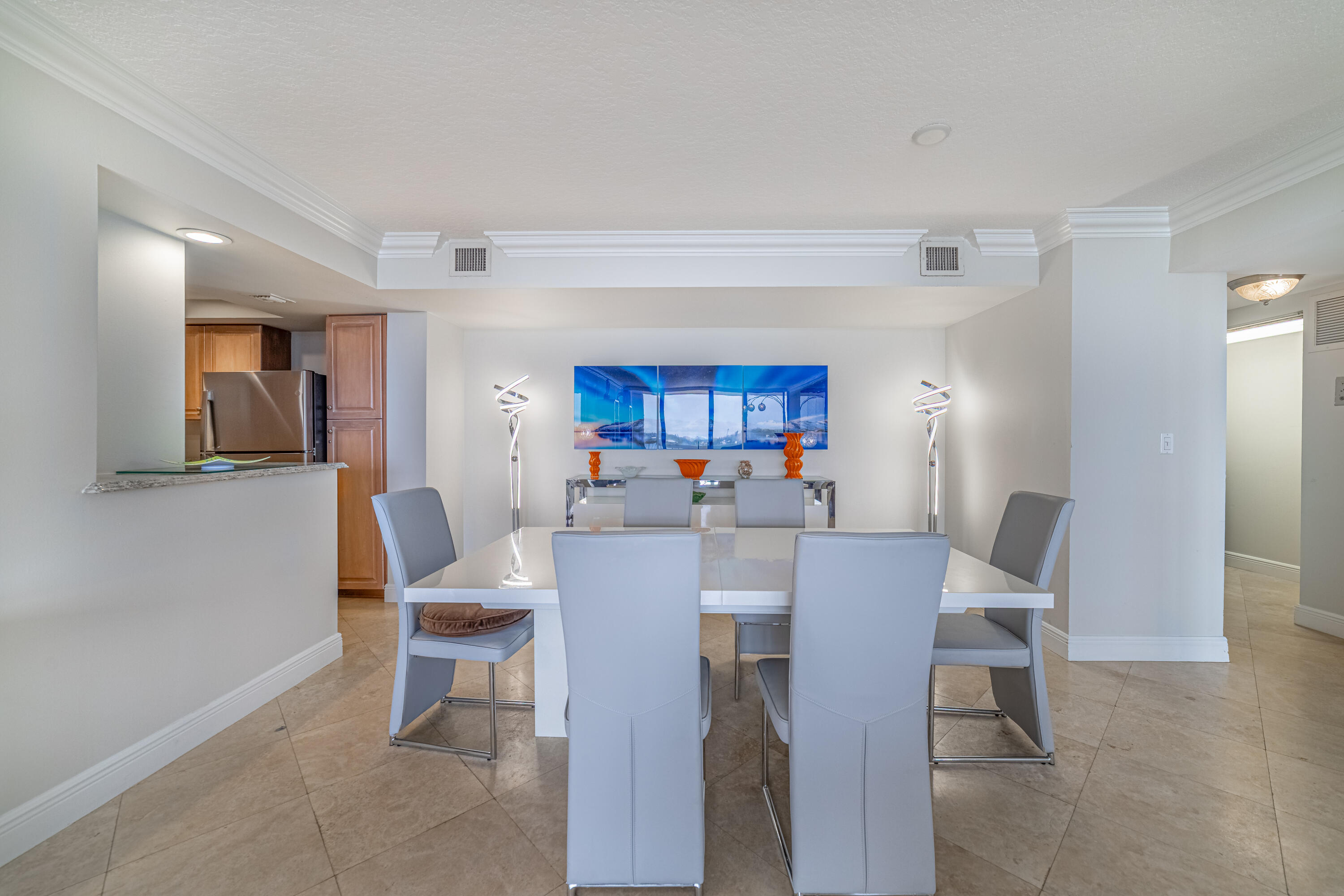 3250 South Ocean Boulevard, Unit 507N Palm Beach, FL 33480 - Photo 29 of 56 a view of a dining room with furniture and a potted plant