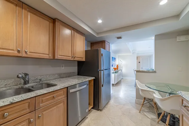 a white bath tub sitting next to a white sink