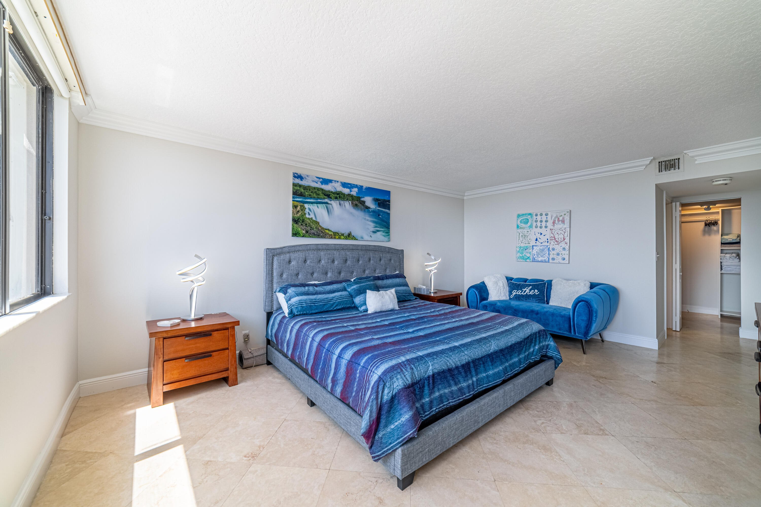 3250 South Ocean Boulevard, Unit 507N Palm Beach, FL 33480 - Photo 33 of 56 a bedroom with a bed and a painting on the wall