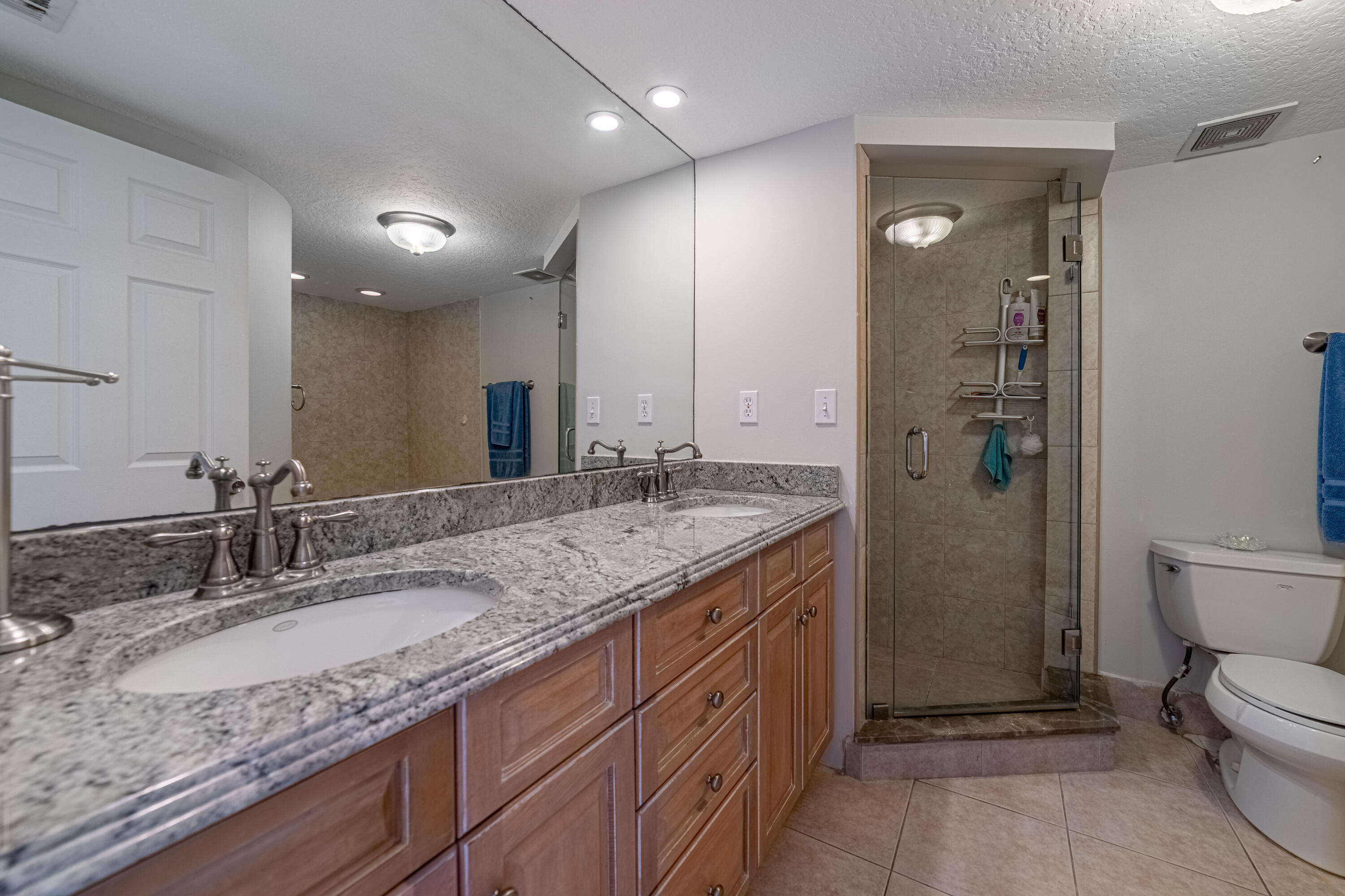3250 South Ocean Boulevard, Unit 507N Palm Beach, FL 33480 - Photo 36 of 56 a bathroom with a granite countertop sink and a mirror
