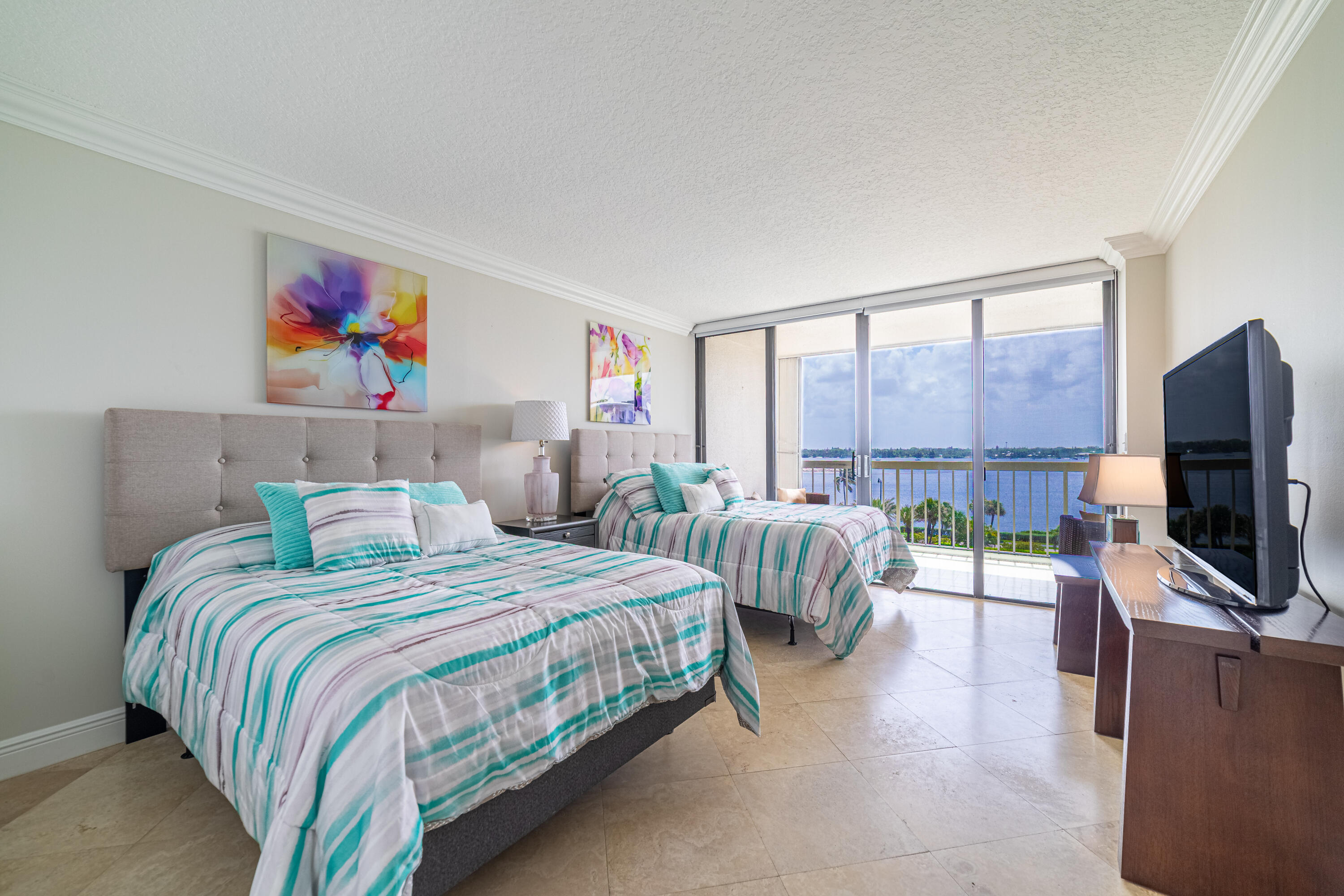 3250 South Ocean Boulevard, Unit 507N Palm Beach, FL 33480 - Photo 39 of 56 a bedroom with two beds and a flat screen tv