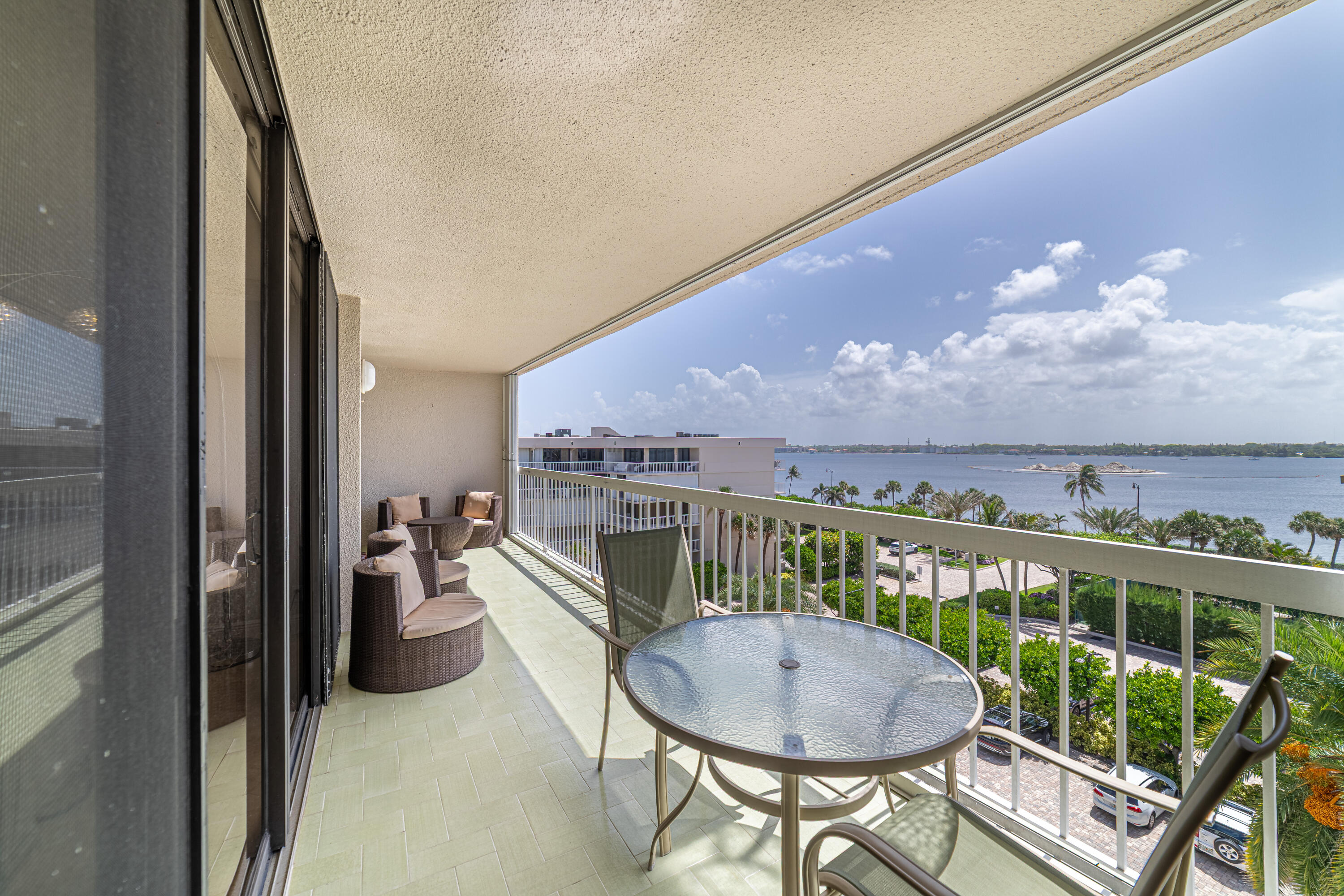 3250 South Ocean Boulevard, Unit 507N Palm Beach, FL 33480 - Photo 47 of 56 a view of a dining room with furniture and chandelier