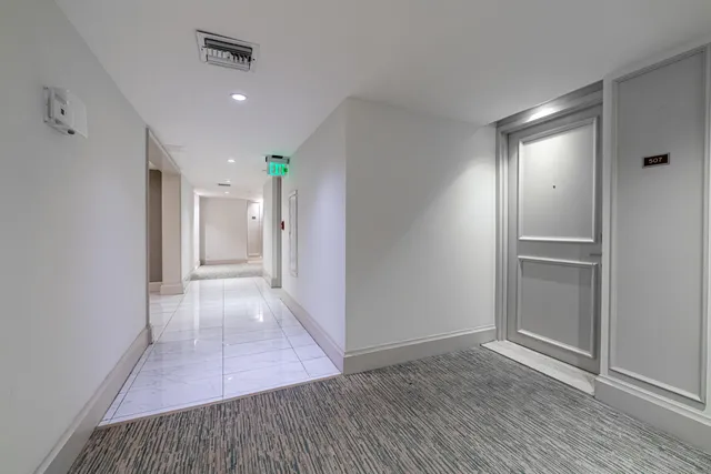 a view of a garden with a building