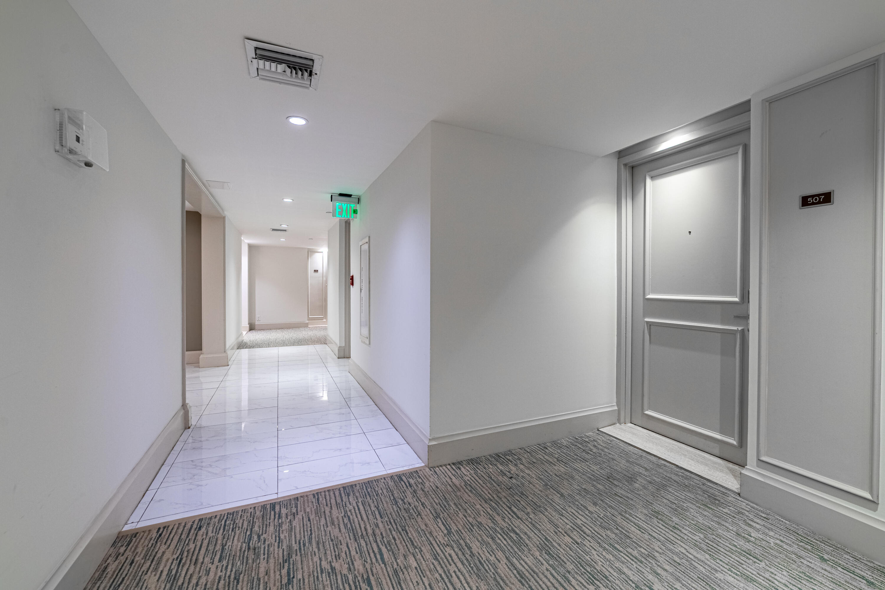 3250 South Ocean Boulevard, Unit 507N Palm Beach, FL 33480 - Photo 48 of 56 a view of a hallway with wooden floor