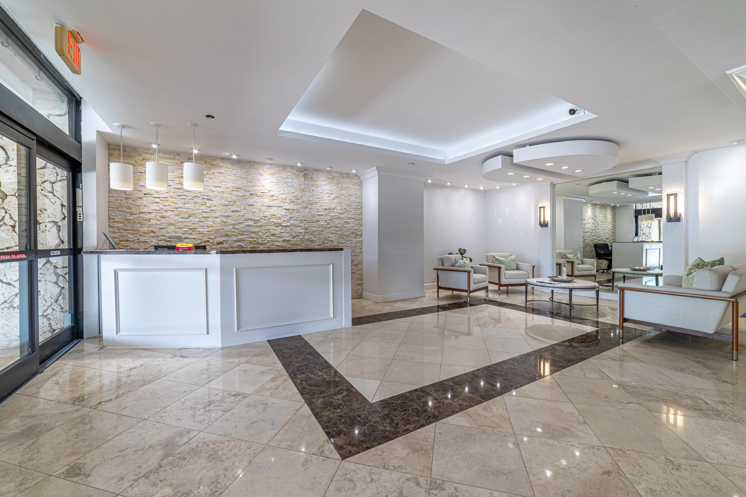 3250 South Ocean Boulevard, Unit 507N Palm Beach, FL 33480 - Photo 49 of 56 a kitchen with a sink a counter top space and stainless steel appliances