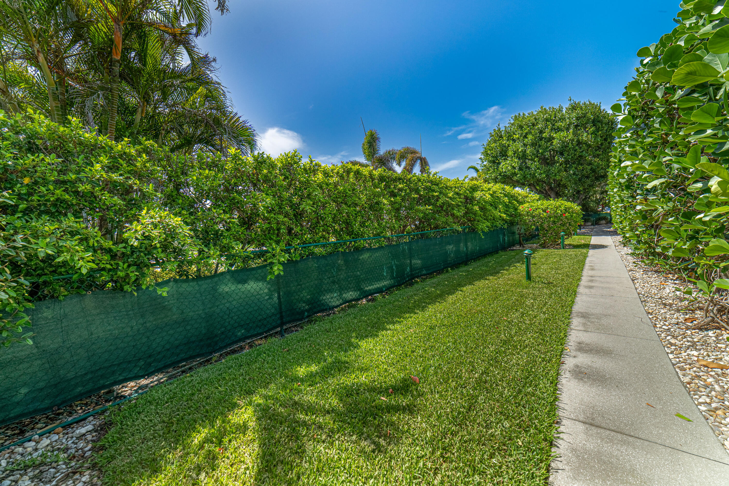3250 South Ocean Boulevard, Unit 507N Palm Beach, FL 33480 - Photo 54 of 56 a view of a garden with a building