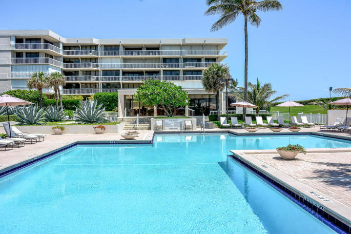 3250 South Ocean Boulevard, Unit 507N Palm Beach, FL 33480 - Photo 10 of 56 a swimming pool with outdoor seating and yard