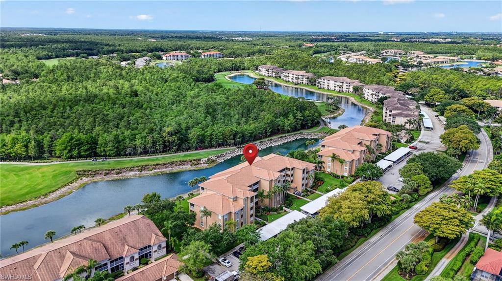 3830 Sawgrass Way, Unit 2922 Naples, FL 34112 - Photo 12 of 43 an aerial view of residential houses with outdoor space and swimming pool