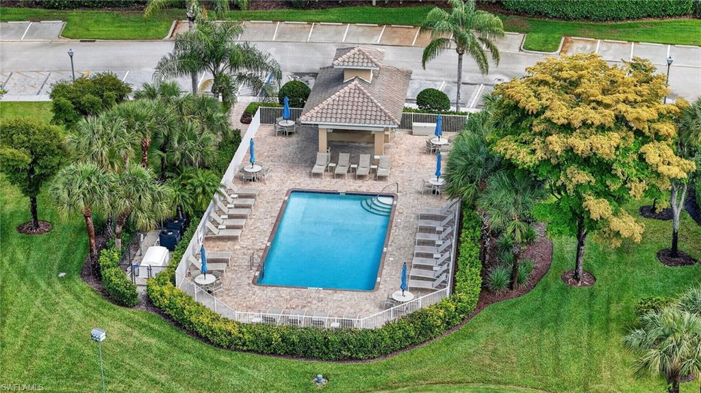 3830 Sawgrass Way, Unit 2922 Naples, FL 34112 - Photo 14 of 43 an aerial view of a house with a yard and large trees