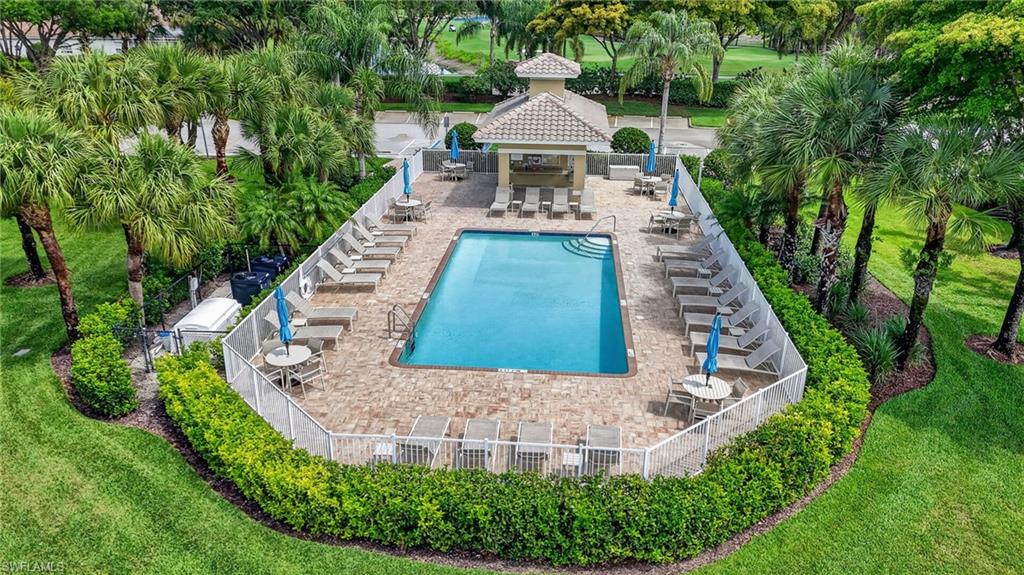 3830 Sawgrass Way, Unit 2922 Naples, FL 34112 - Photo 15 of 43 a view of a house with a yard