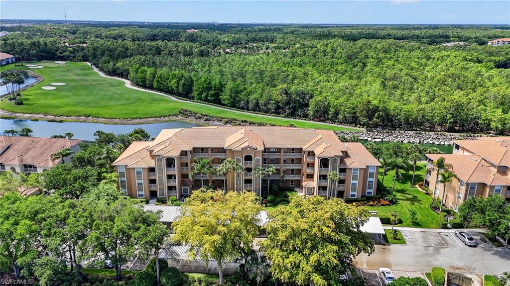 3830 Sawgrass Way, Unit 2922 Naples, FL 34112 - Photo 3 of 43 an aerial view of a house with big yard