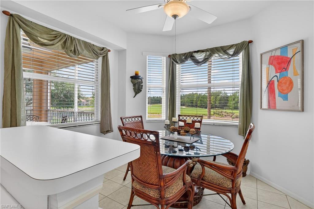 3830 Sawgrass Way, Unit 2922 Naples, FL 34112 - Photo 32 of 43 a dining room with furniture and window