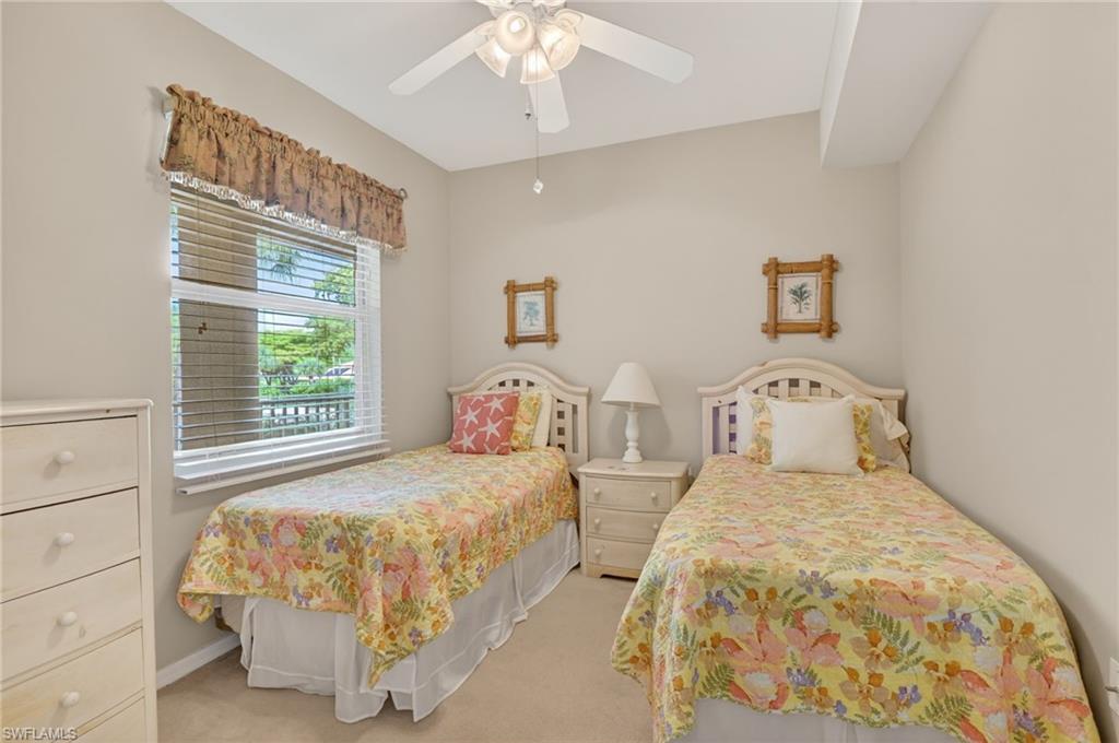 3830 Sawgrass Way, Unit 2922 Naples, FL 34112 - Photo 38 of 43 a bedroom with two beds and a window