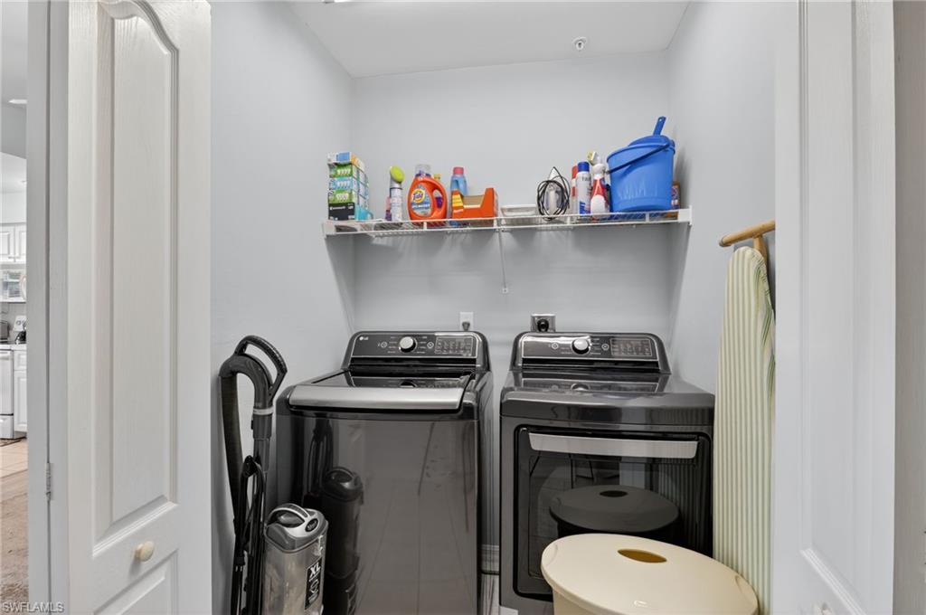 3830 Sawgrass Way, Unit 2922 Naples, FL 34112 - Photo 41 of 43 a utility room with dryer and washer
