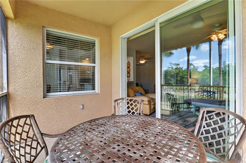 3830 Sawgrass Way, Unit 2922 Naples, FL 34112 - Photo 43 of 43 a bedroom with a bed and a window
