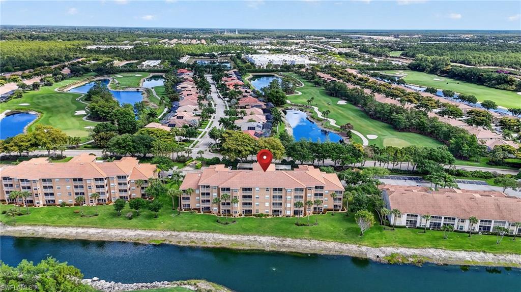 3830 Sawgrass Way, Unit 2922 Naples, FL 34112 - Photo 9 of 43 an aerial view of residential houses with outdoor space and lake view