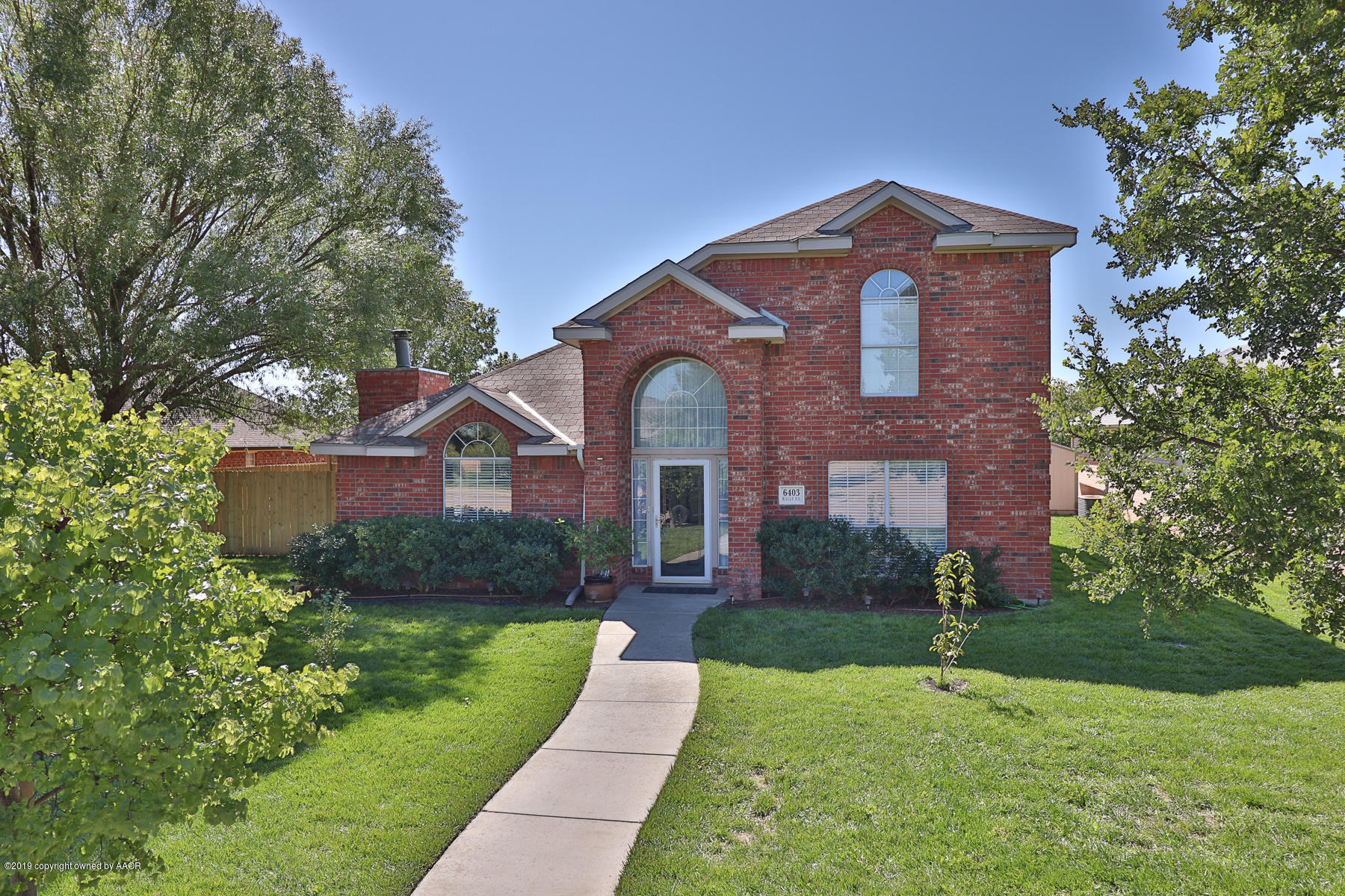 6403 Rally Road Amarillo, TX 79119 - Photo 1 of 24 a front view of a house with yard
