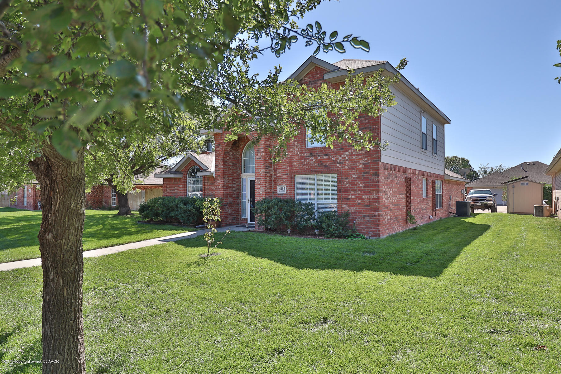 6403 Rally Road Amarillo, TX 79119 - Photo 2 of 24 a backyard of a house with lots of green space