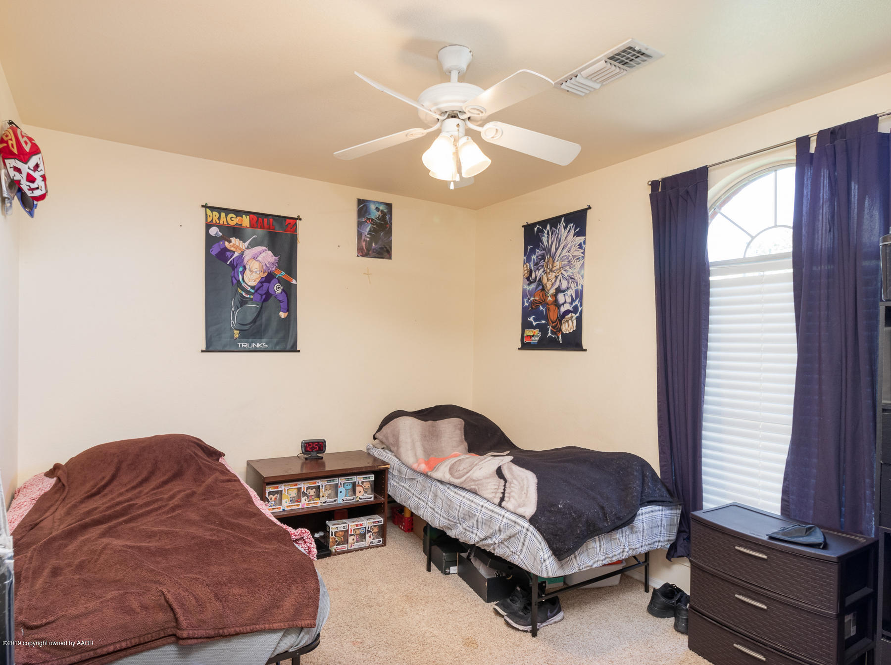 6403 Rally Road Amarillo, TX 79119 - Photo 20 of 24 a bedroom with furniture and a window