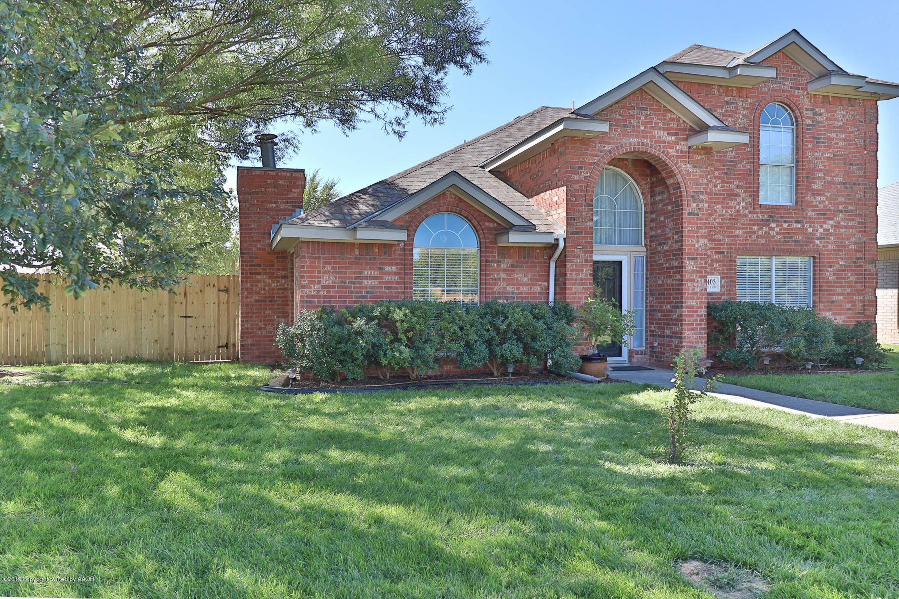 6403 Rally Road Amarillo, TX 79119 - Photo 3 of 24 a front view of a house with a yard