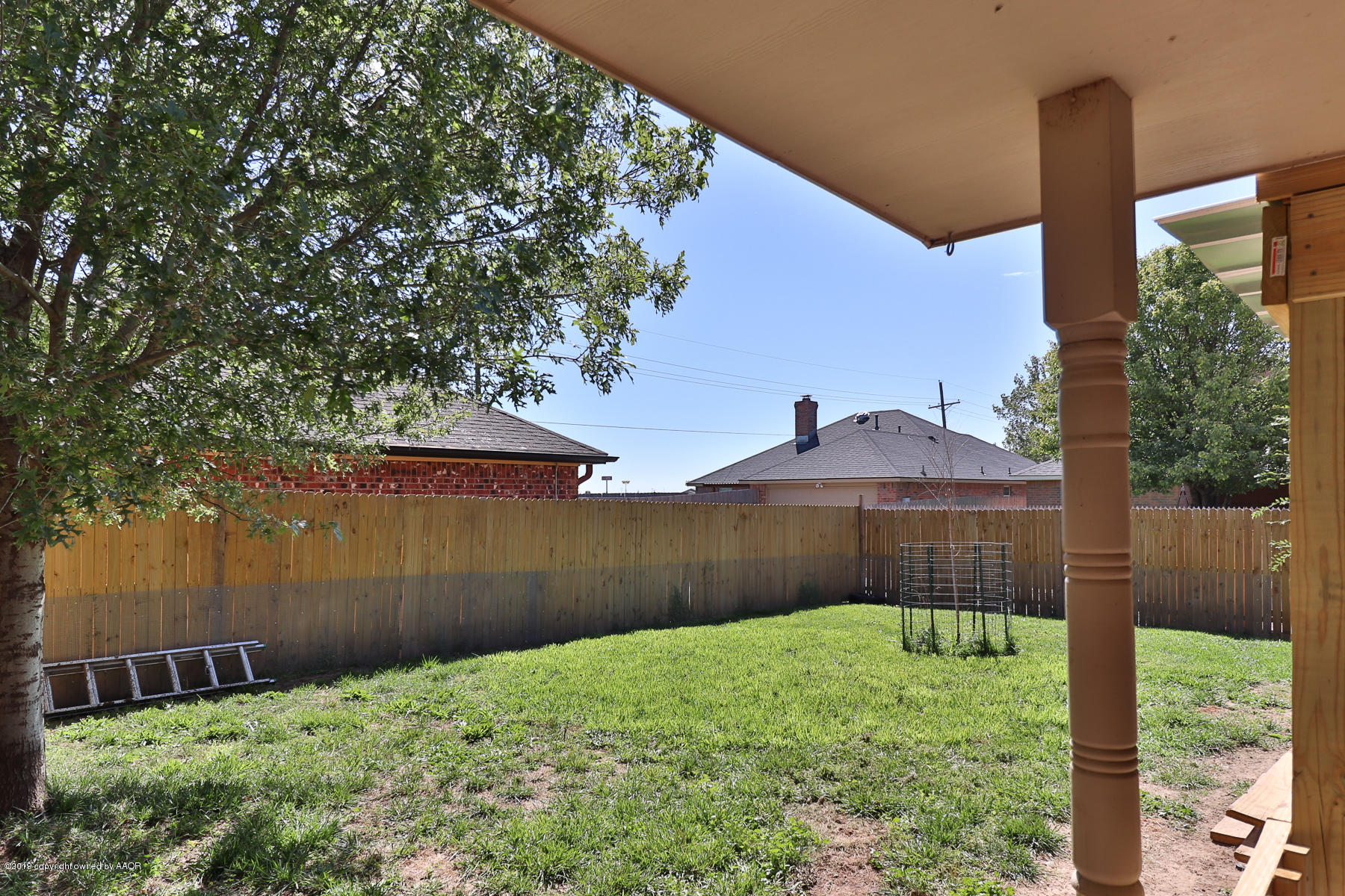 6403 Rally Road Amarillo, TX 79119 - Photo 24 of 24 a backyard of a house with lots of green space