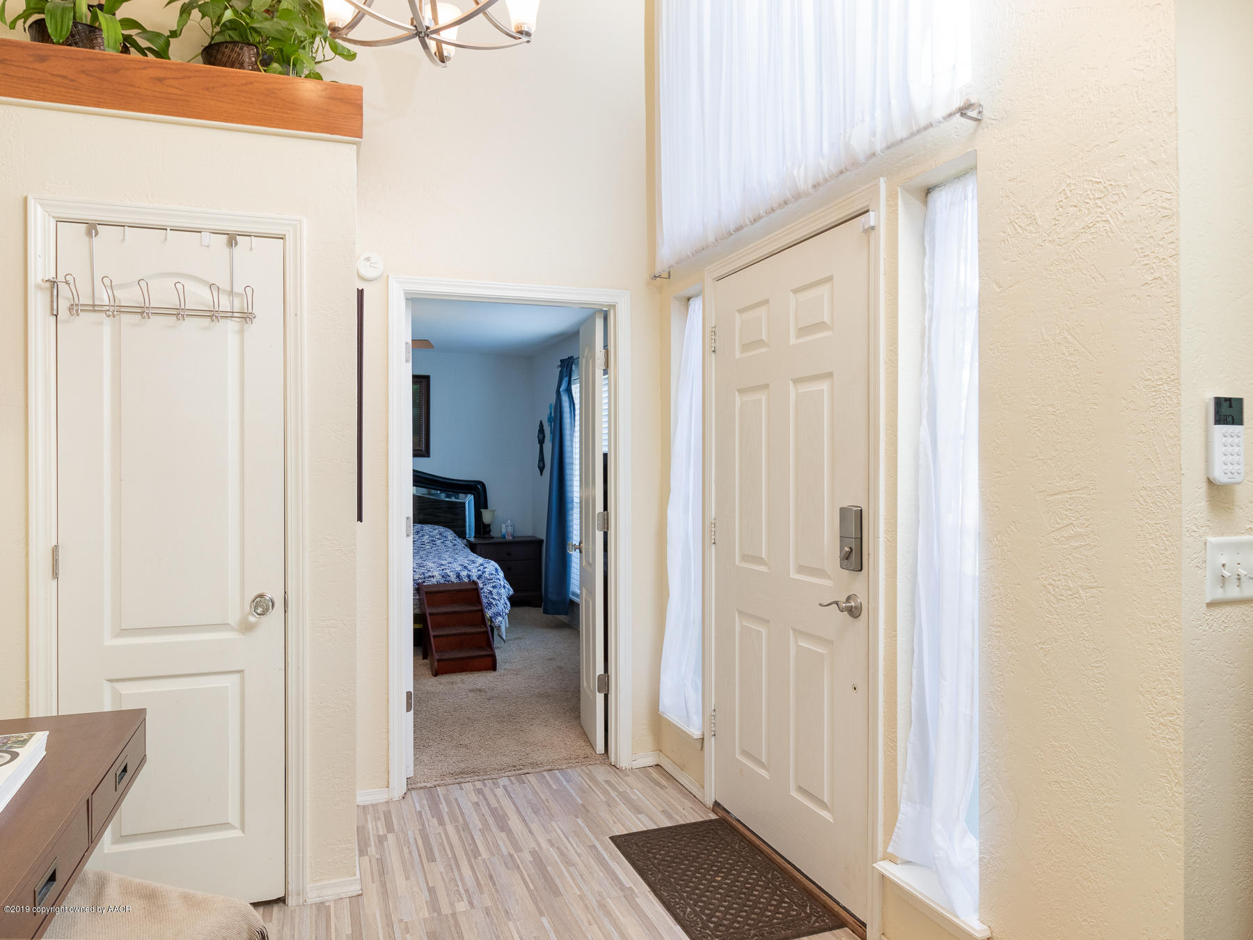 6403 Rally Road Amarillo, TX 79119 - Photo 5 of 24 a view of a bedroom from a hallway