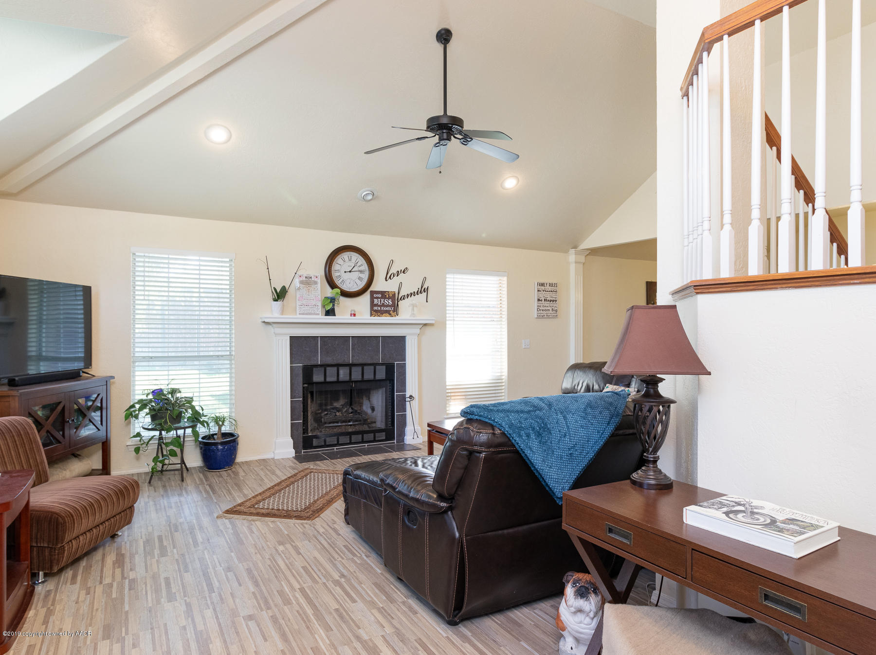 6403 Rally Road Amarillo, TX 79119 - Photo 6 of 24 a living room with furniture and a fireplace