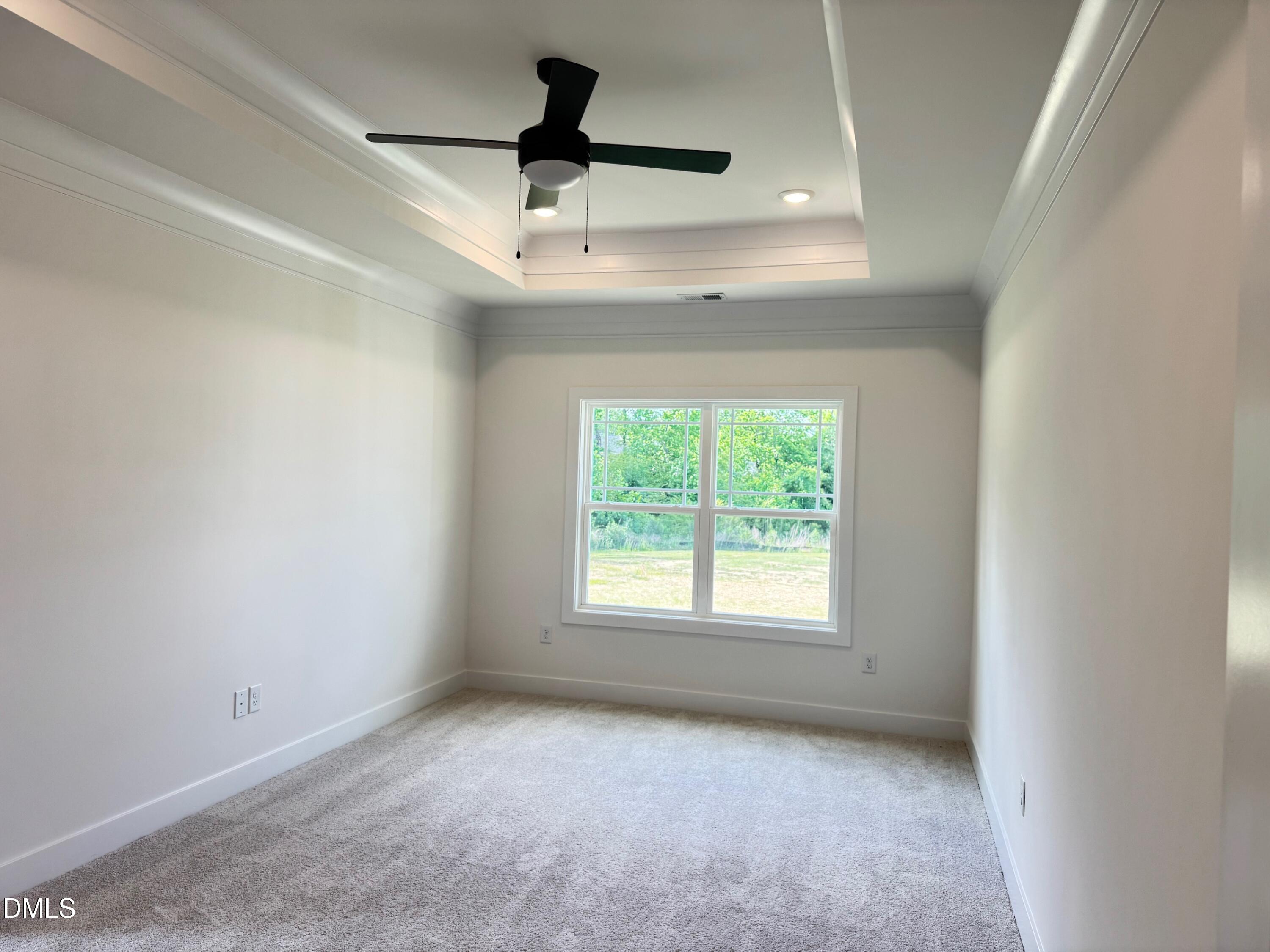 20 Streamline Court Lillington, NC 27546 - Photo 21 of 46 an empty room with a ceiling fan and a window