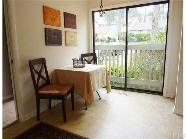 824 Green Ridge Drive Raleigh, NC 27609 - Photo 3 of 17 a view of a workspace with furniture and a window