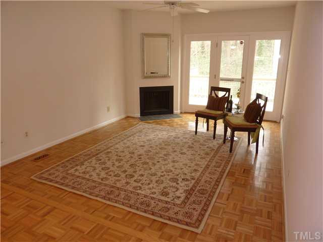824 Green Ridge Drive Raleigh, NC 27609 - Photo 5 of 17 a living room with furniture rug and a fireplace