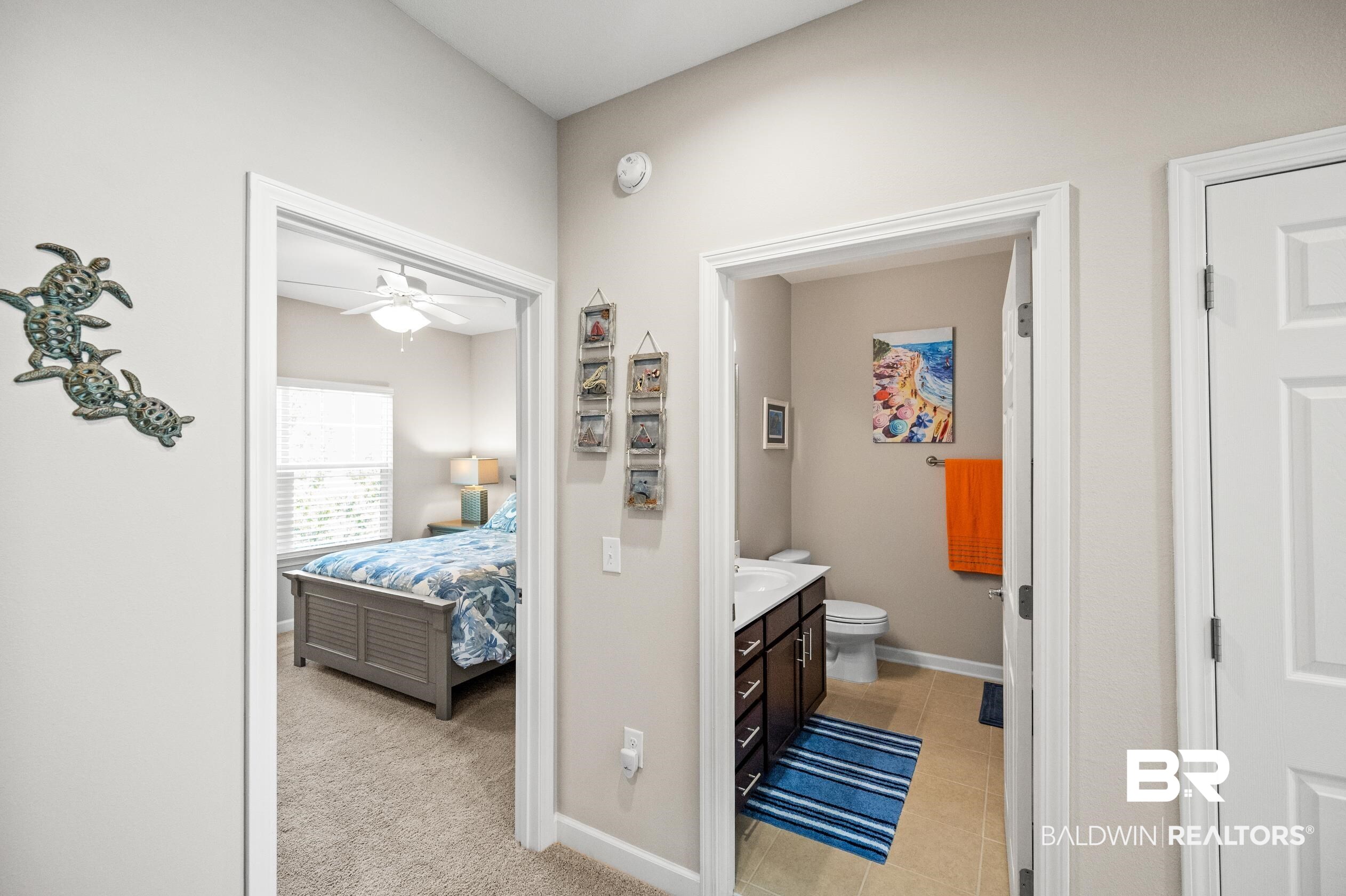 430 West Fort Morgan Road, Unit 1902 Gulf Shores, AL 36542 - Photo 31 of 59 Bathroom featuring vanity, tile patterned flooring, toilet, and ceiling fan