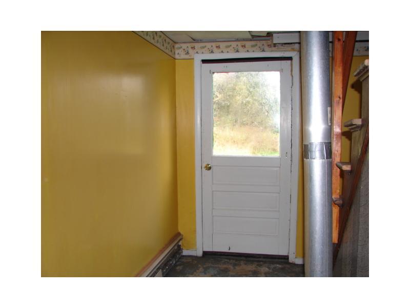 157 Port Road Machiasport, ME 04655 - Photo 17 of 25 Basement. Outside door in the...