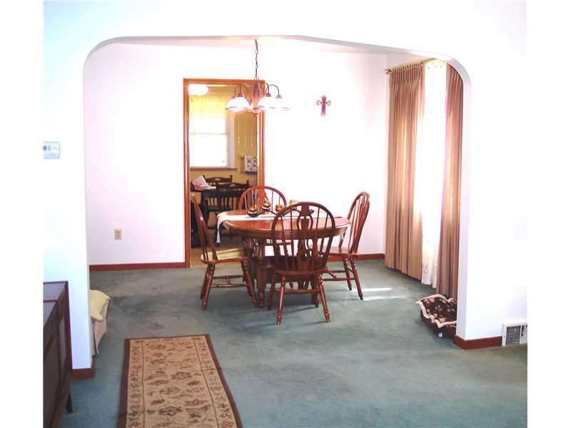 Dining Room. View of the Bright, Cheerful dining room that leads into the kitchen.